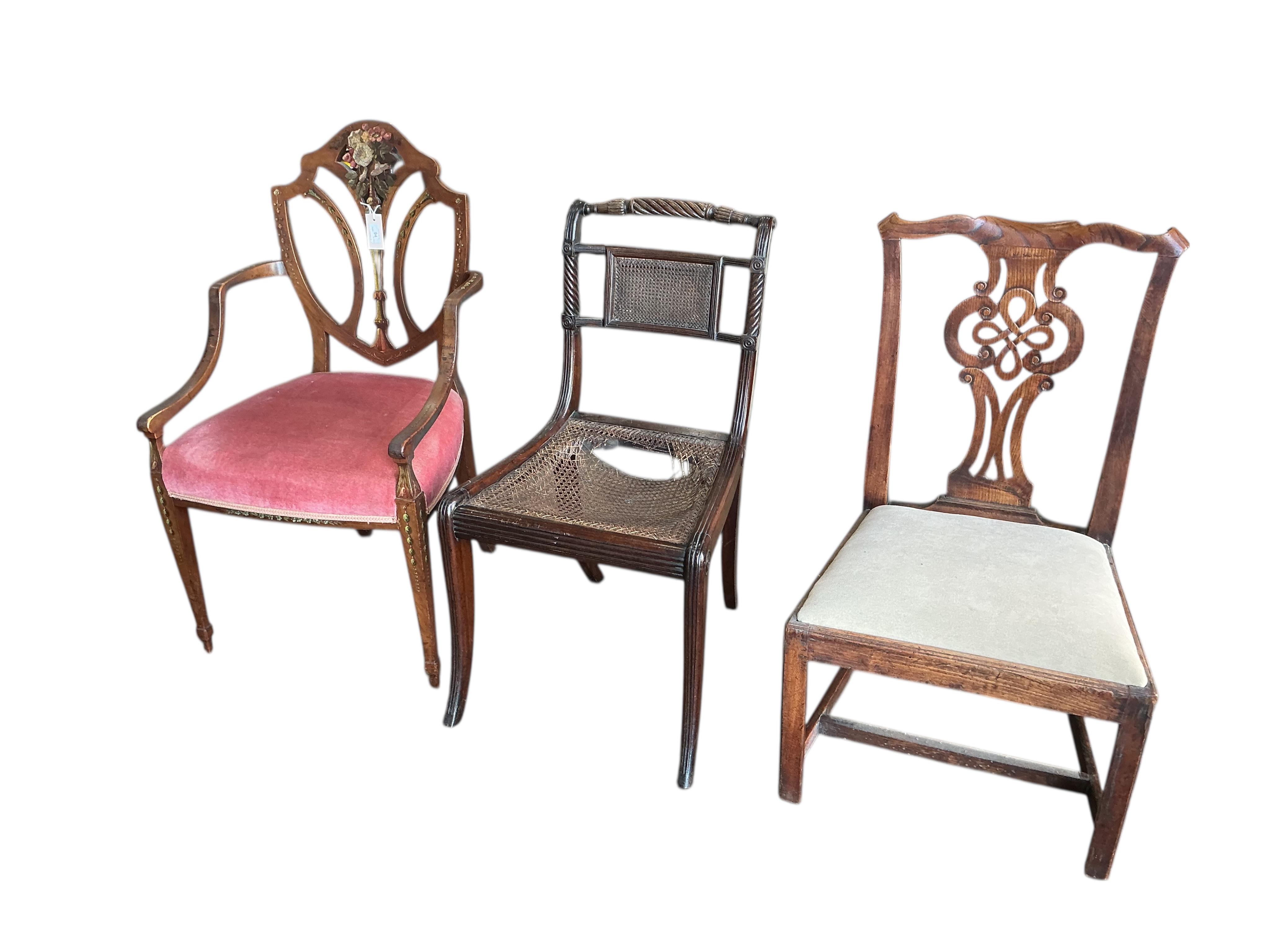 A Hepplewhite style painted mahogany elbow chair and a Regency cane seated single chair and a George III Provincial elm chair